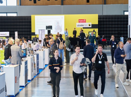 Visitors walk around the exhibition hall 