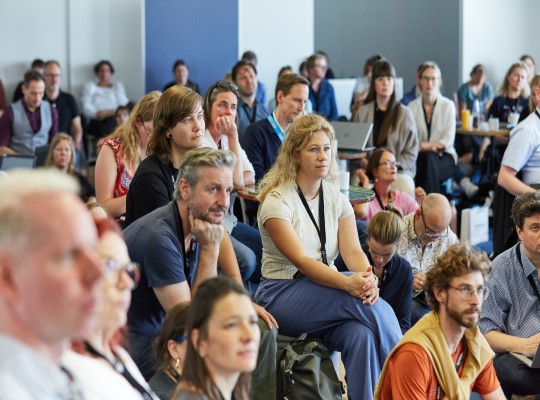 The audience listen to a presentation 